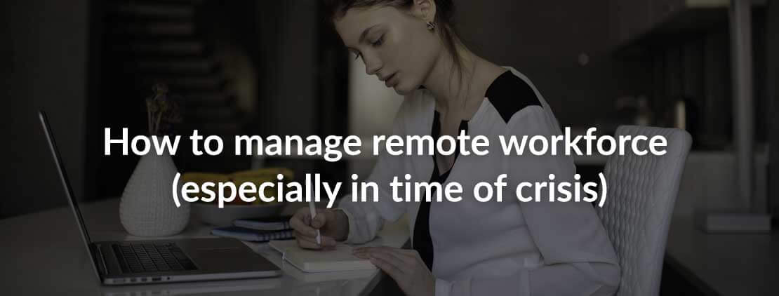 Women sitting in front of a desk with a laptop writing on a notebook