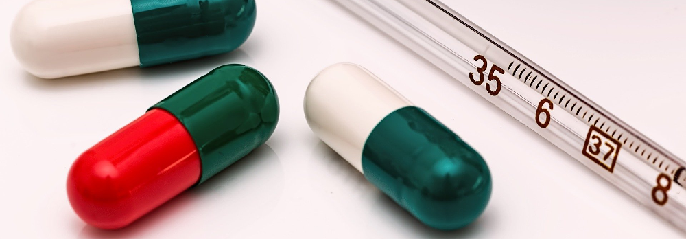 3 pills and a thermometer