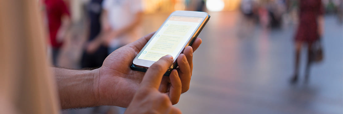 A person reading SMS from a smartphone