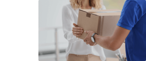 Photo of delivery driver handing package to recipient